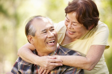 older asian couple smiling
